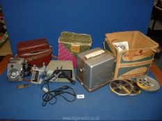 A quantity of film camera equipment to include; a mini 'Kokokv' 8mm projector, reels,