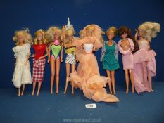 A quantity of Barbie dolls made in Malaysia, eight in total, blonde and brunette.