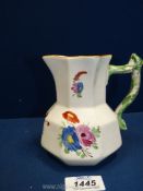 A Dillwyn Swansea pottery jug of octagonal form colourfully decorated with stylised flowers and