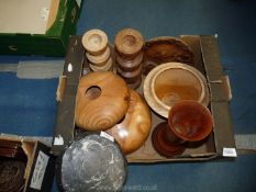 A quantity of treen items including a pair of turned candlesticks, vase, bowls, etc.