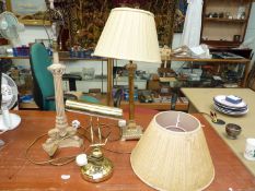 Three lamps, including brass effect bankers lamp, brass Corinthian column lamp, plus another,