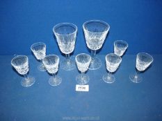 Seven liqueur glasses (5 marked Waterford), plus a Waterford sherry glass and one similar.