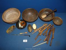 A box of treen including small spindles/bobbins, wooden bowls, a pestle, etc.