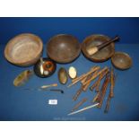 A box of treen including small spindles/bobbins, wooden bowls, a pestle, etc.