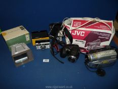 A boxed compact VHS camcorder together with a Kodak Instamatic camera a/f.