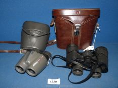 Two pairs of cased Binoculars including Nikon 10 x 25 and Adlerblick 8 x 42.