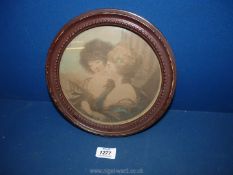 A circular framed Print of two ladies reading sheet music, 9 1/2'' diameter,