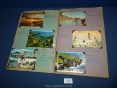 A Cuttings book of 1960's-1970's views and comic/saucy postcards;