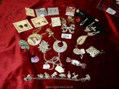 A quantity of jewellery including brooches, earrings (some Welsh), charm bracelet etc.