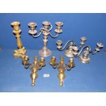 A quantity of plated and brass items including three and two branch candelabra, wall sconces etc.