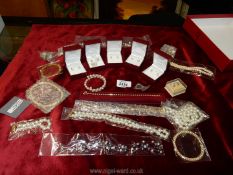 A quantity of faux pearl jewellery including earrings,