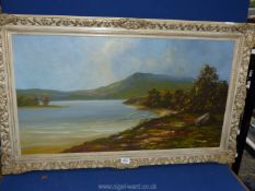 A large framed Oil on canvas depicting a large lake with trees on both sides and hills in the