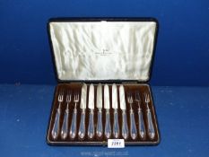 A cased set of Walker and Hall fruit knives and forks for six.