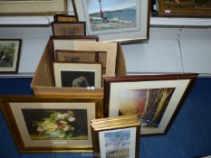 A box of paintings and prints.