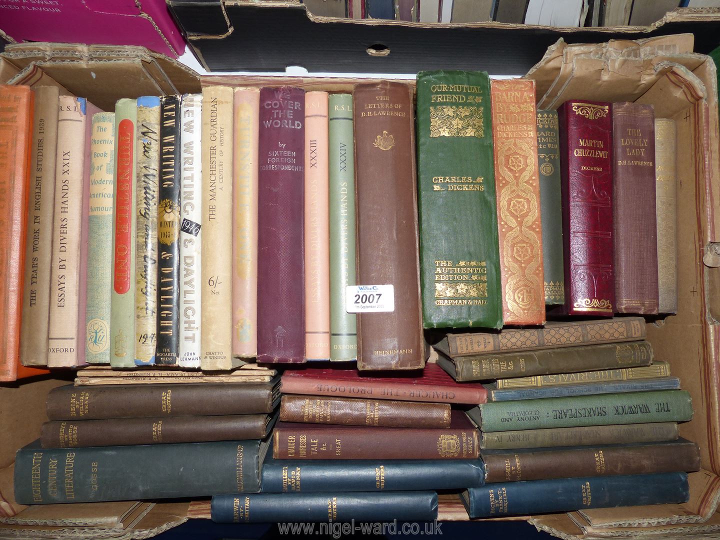 A box of books including 'Essay's by Divers', Dickens, 'The Letters of D.H Lawrence', 18th c.