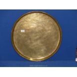 A large brass charger with stylised beasts engraved detail, 23'' diameter.