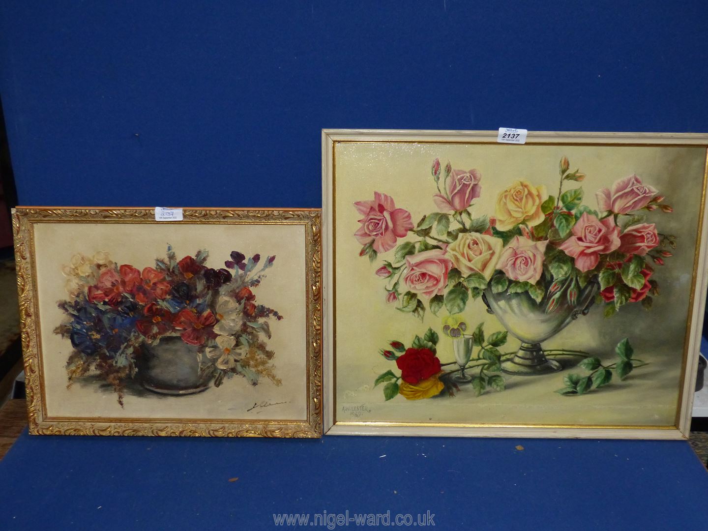 An oil on canvas floral still life indistinctly signed and a 1969 painting of roses in a vase