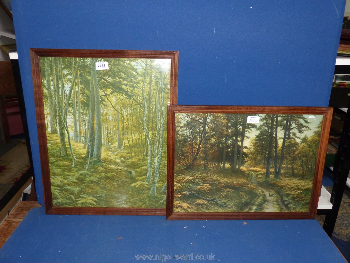 A pair of framed Prints of woodland scenes by Joseph Farquharson R.A.