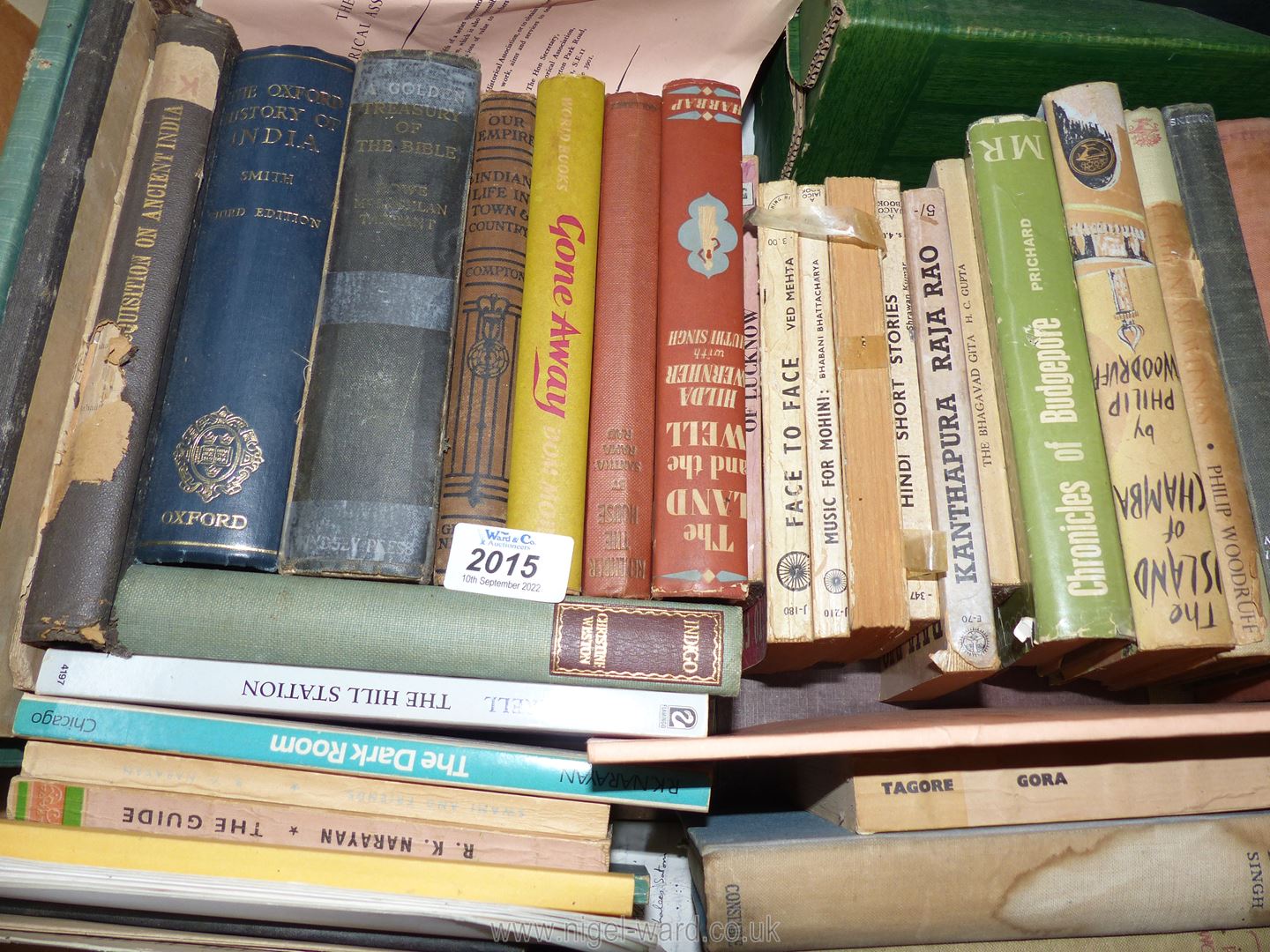 A box of books including 'The Journal of The Benares Hindu University 1940',