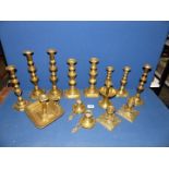 A quantity of brass including pairs of candlesticks and chambersticks, etc.