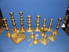 A quantity of brass including pairs of candlesticks and chambersticks, etc.