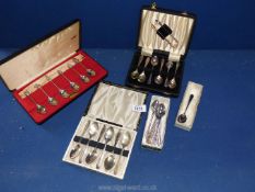 A quantity of cased plated spoons to include; Apostle spoons, set of 6 spoons & sugar tongs,