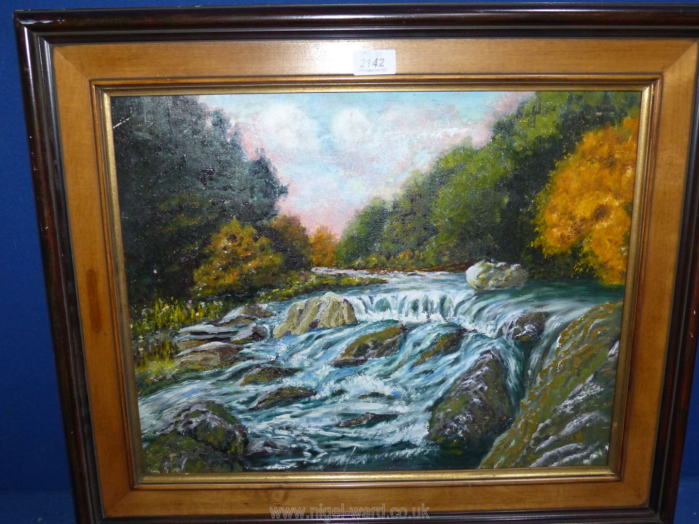 An Oil on canvas of a Boulder strewn river.