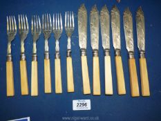 A set of six Epns bladed fish knives and forks with bone handles, and silver collars.