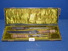 A Taylor's Eye Witness Sheffield carving set, with carved antler handles and silver bands,