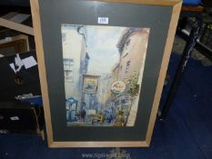 A large wooden framed and mounted watercolour depicting a street scene with the Grape Tavern,