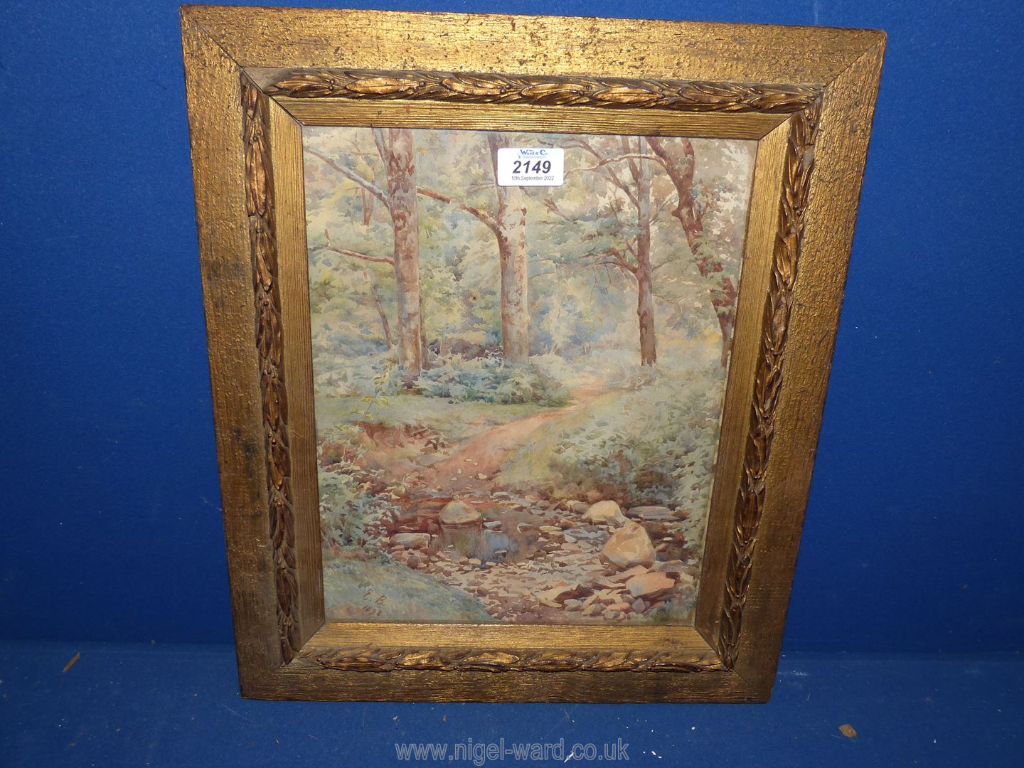 In the manner of Eleanor Brickdale, Watercolour of woodland and stream,
