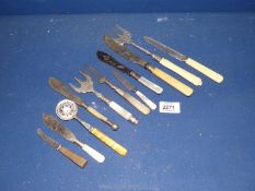 A quantity of miscellaneous mother of pearl handled cutlery to include butter knives, bread fork,