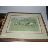 A framed and mounted Joy Hawker limited edition print of Two terriers playing with a piece of