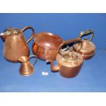 A quantity of copper including kettle and footed kettle, large and small jugs, and chamber pot.