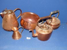 A quantity of copper including kettle and footed kettle, large and small jugs, and chamber pot.