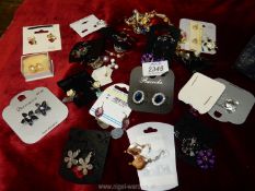 A quantity of miscellaneous earrings including clip on, drop, and stud earrings,