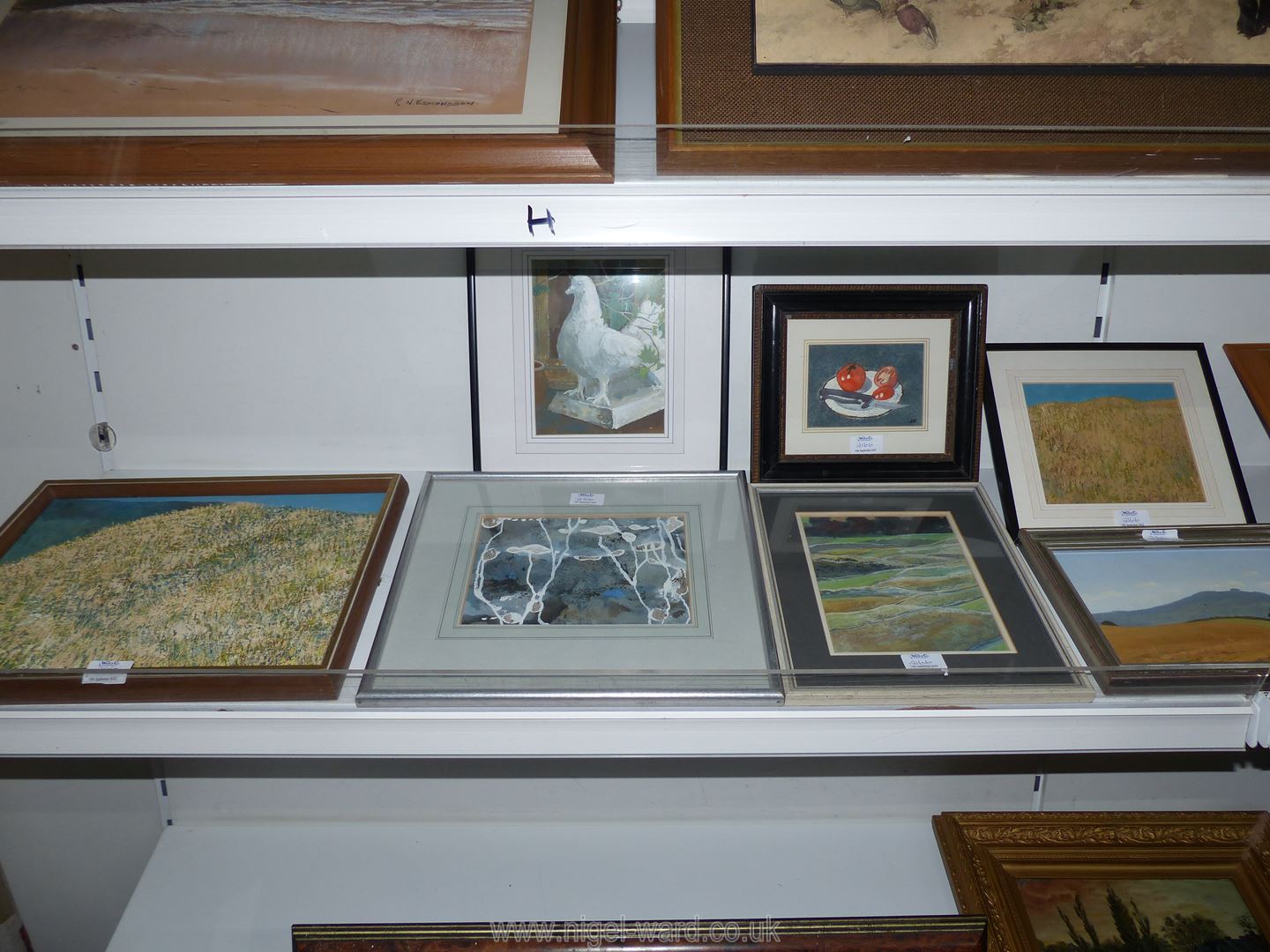 A quantity of paintings including an oils on board of a grassy knoll and May Hill by F.