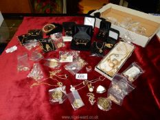 A quantity of gold coloured and plated modern jewellery including earrings, necklaces,