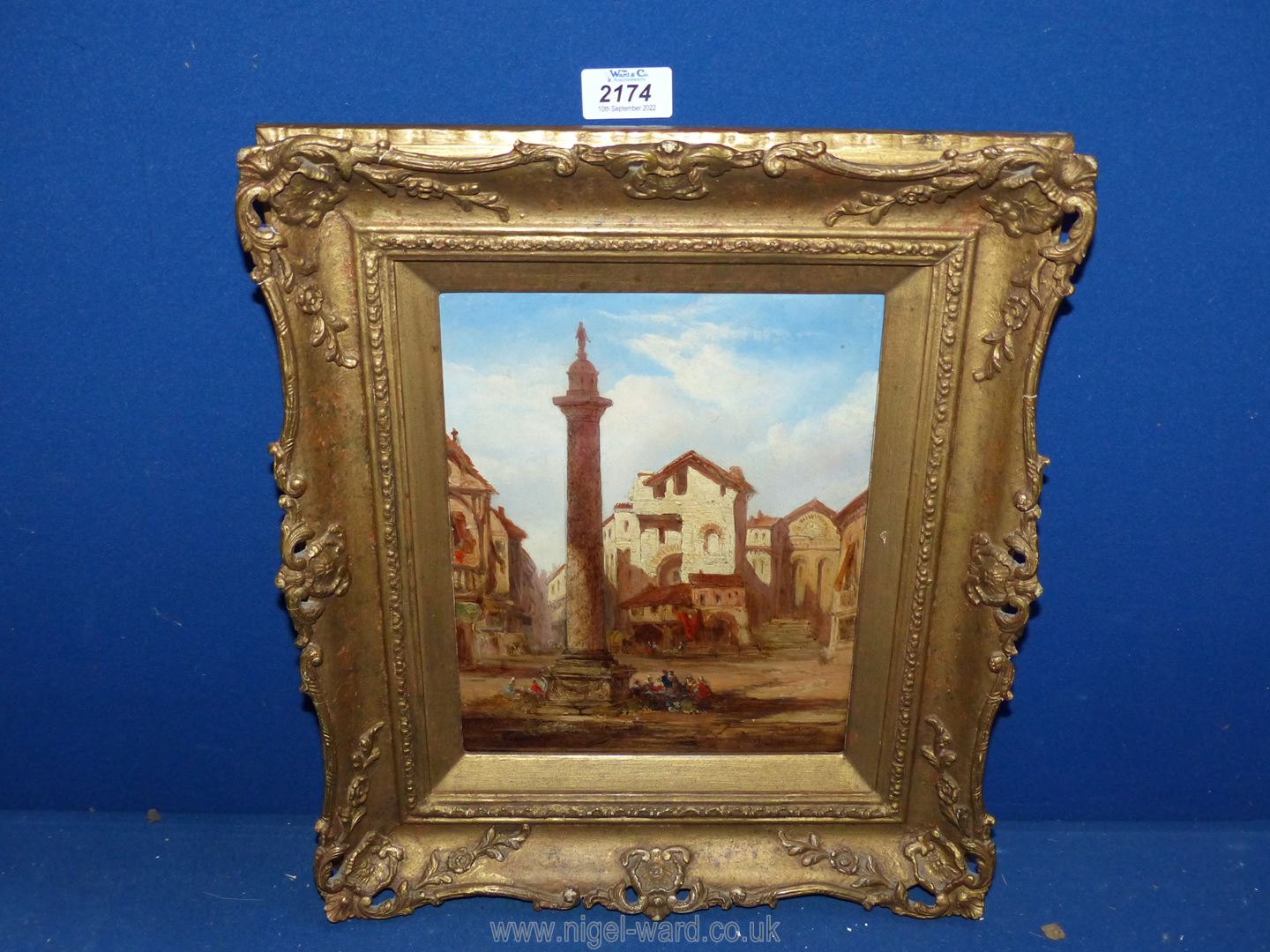 An ornate framed oil on board, label verso 'View of a Continental Square', signed lower right 'C.