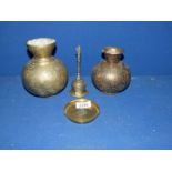Two attractive oriental brass vases with intricate engraving,