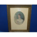 An ornately framed oval mounted print of a young lady holding flowers