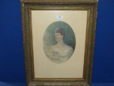 An ornately framed oval mounted print of a young lady holding flowers