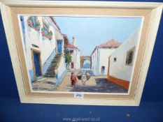 A framed oil on canvas depicting a lady with a mule walking through the street,