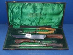 A cased Antler handle carving set made by Wostenholm & Sons.