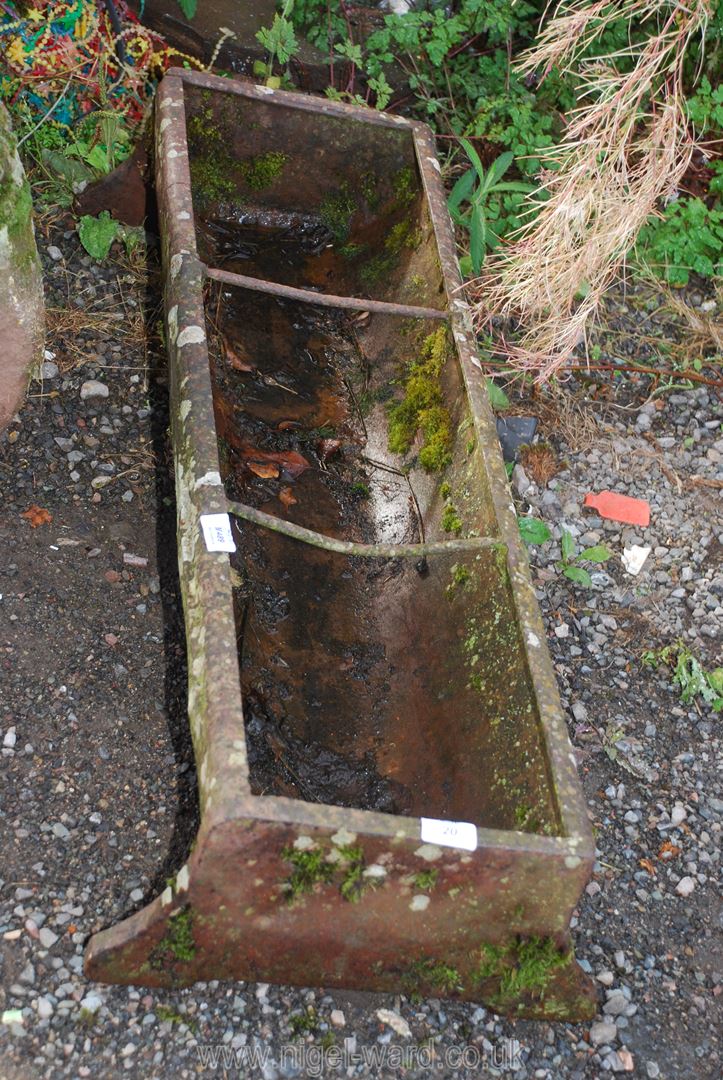 A cast iron pig trough, 37'' long x 11'' deep.