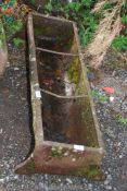 A cast iron pig trough, 37'' long x 11'' deep.