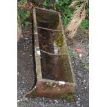 A cast iron pig trough, 37'' long x 11'' deep.