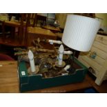 A quantity of wall lights and a table lamp.