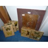 A brass plaque picture and a quantity of butterfly prints.