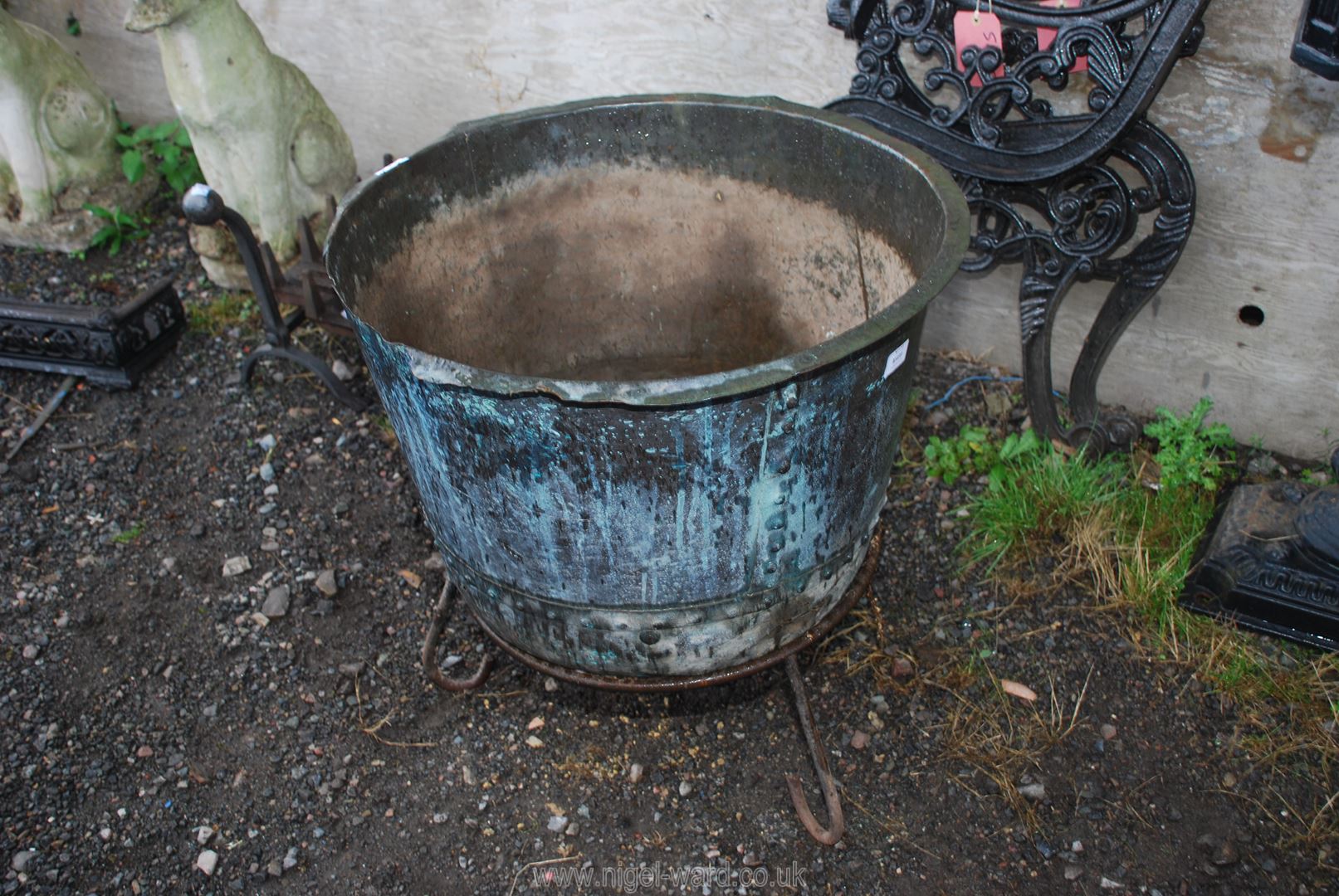 A riveted Copper boiling Pot, converted to planter and stand or useful as a log box,